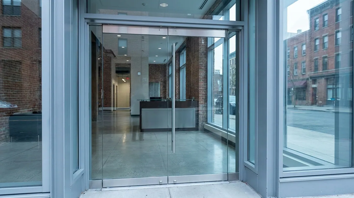 Full-glass commercial door in a Jersey City lobby — Meadowlands Commercial Door Solutions, Jersey City, Hudson County & the Meadowlands, NJ from Meadowlands Commercial Door Solutions
